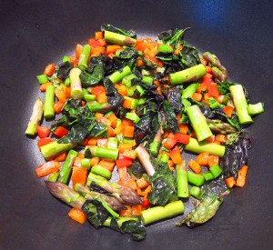 add cut asparagus to pan