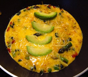 add shredded cheese and avocado slices